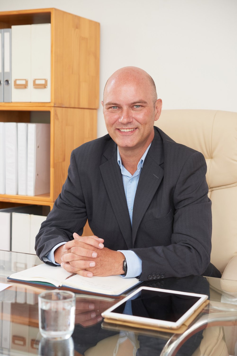 Professional headshot of a personal injury attorney at desk